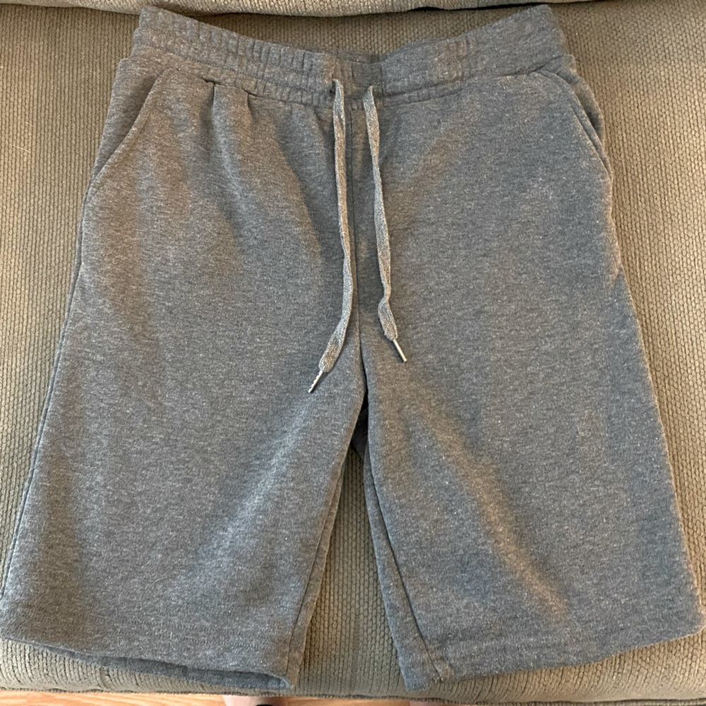Gray sweatpants, material shorts. Knee length, size medium. Great condition.